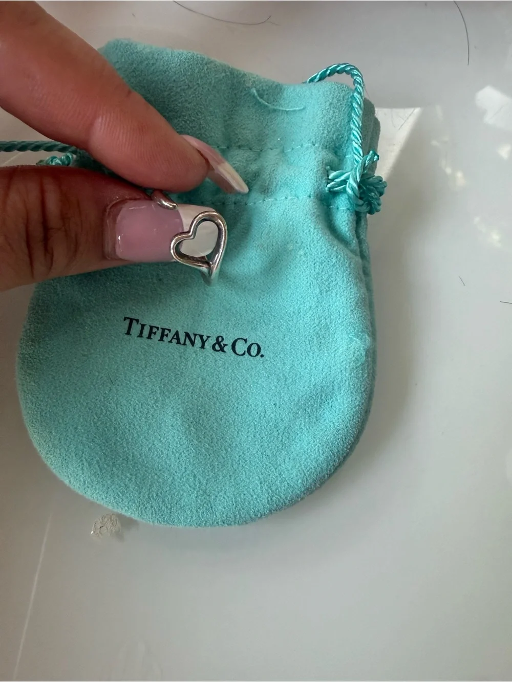 Tiffany heart charm on pouch